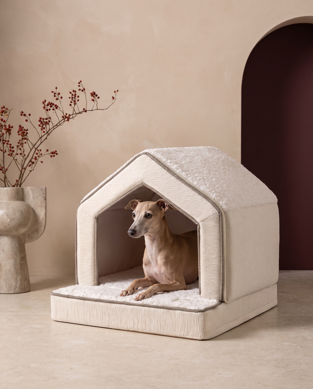 Italian Greyhound resting in the Iggy Grey winter snow house bed