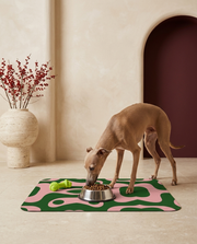 Italian Greyhound eating beside the Iggy Grey food mat