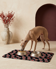 Italian Greyhound eating beside the Iggy Grey food mat