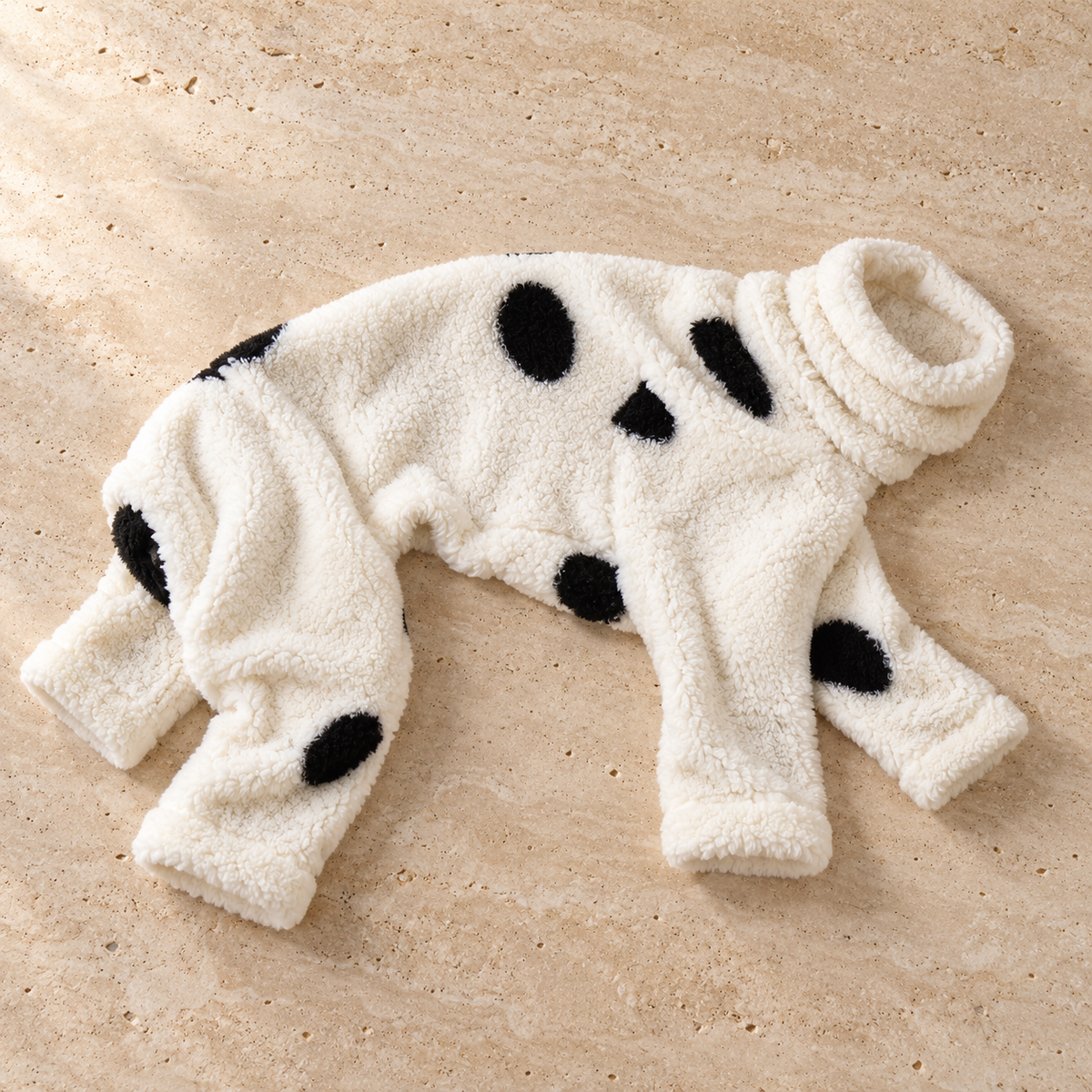 Ivory and black dot coral fleece four-leg pajamas laid flat