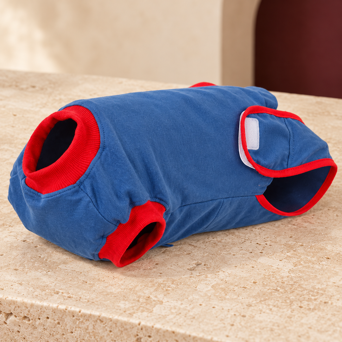 Close-up of the recovery suit’s red trim and fastening panels