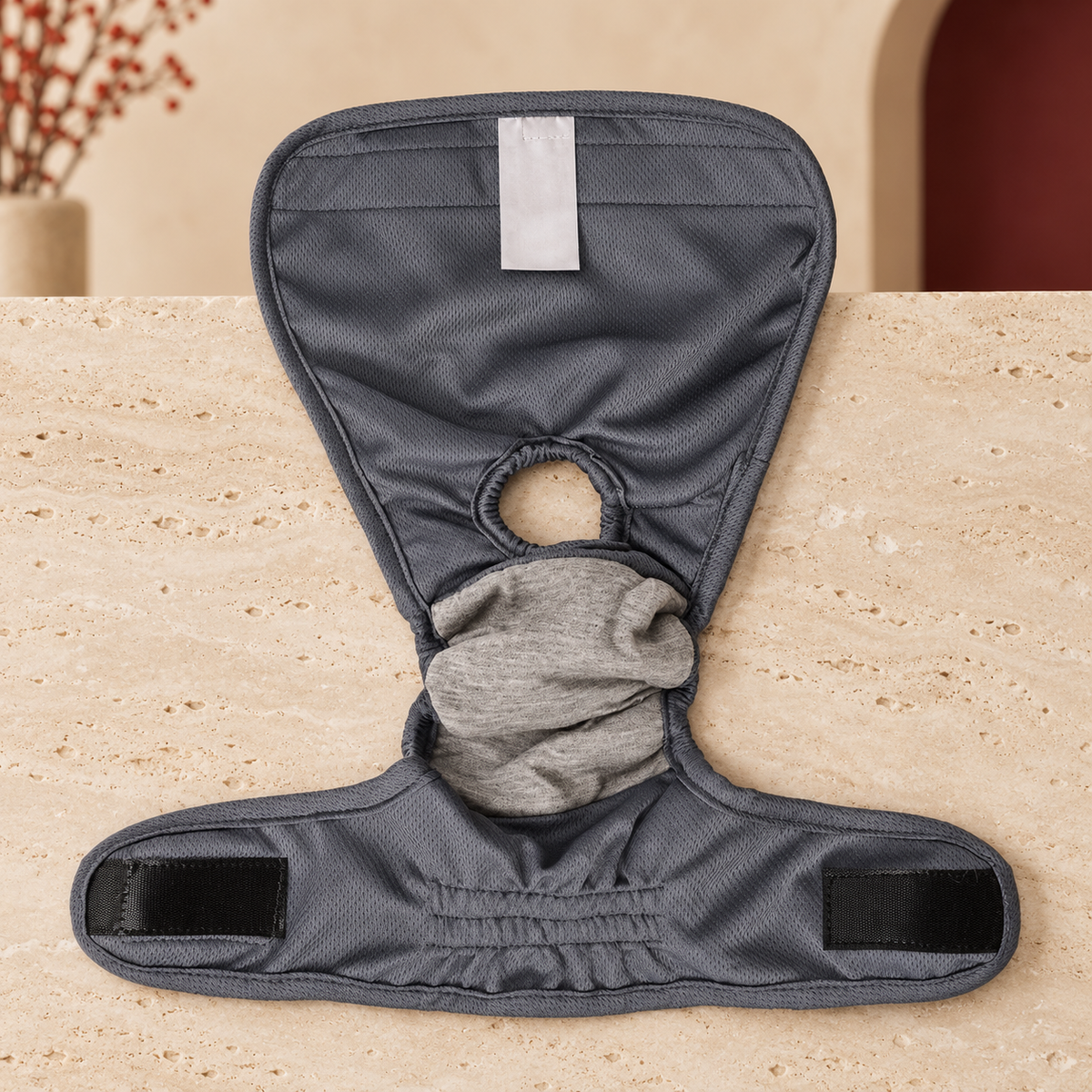 Gray hygiene pants showing the lining, tail opening and fastening tabs