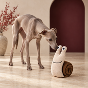 Roll Out Snail Snuffle Dog Toy in Cream & Brown, with an Italian Greyhound