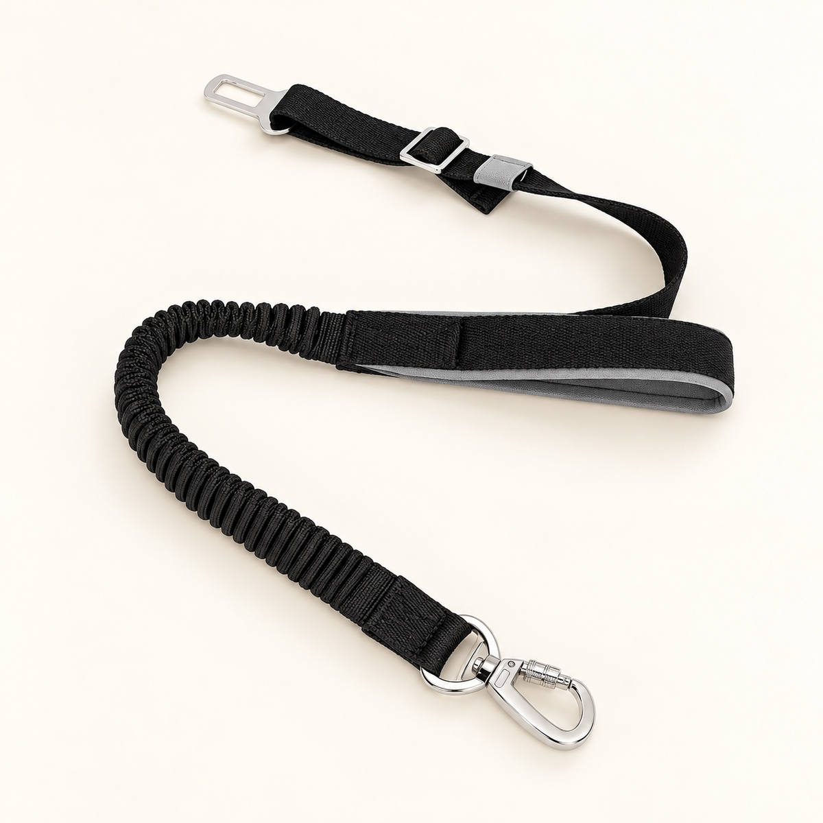 Black adjustable car tether on warm ivory background