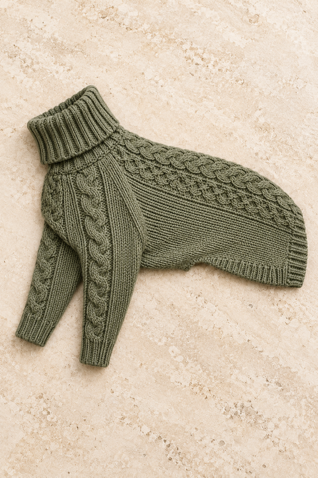 Sage grey dog sweater showing its folded ribbed collar, cable knit and front sleeves